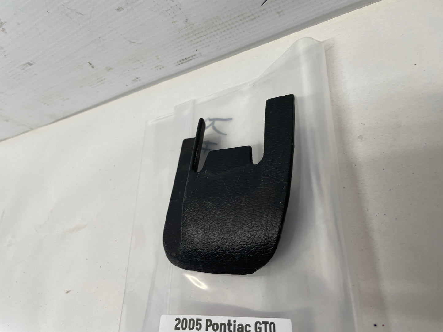 2005 Pontiac GTO RH Passenger Seat Rail Track Bracket Plastic Cover OEM - Day's Parts Yard
