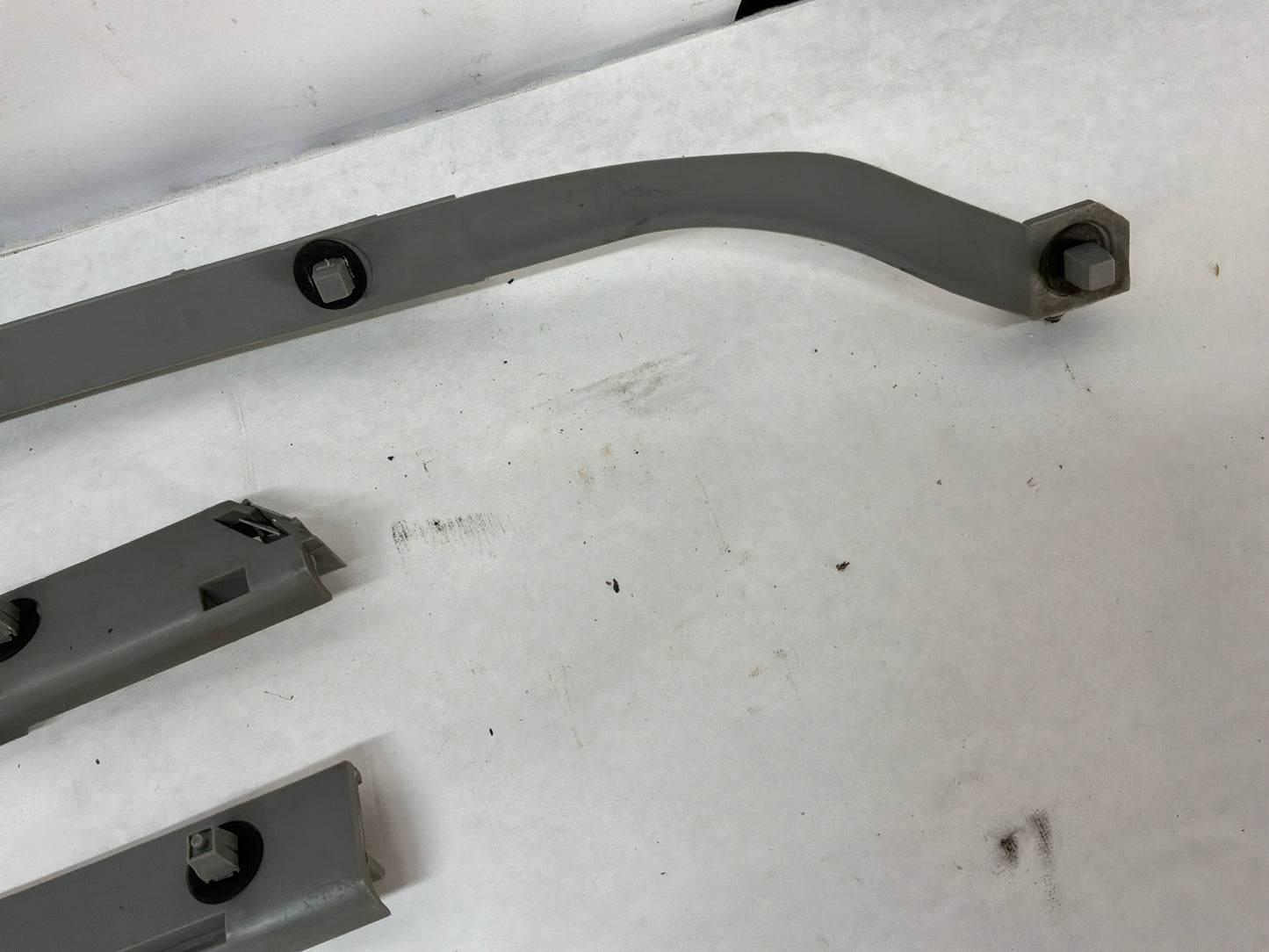 2005 Pontiac GTO RH & LH Rear Bumper Brackets Guides Supports OEM
