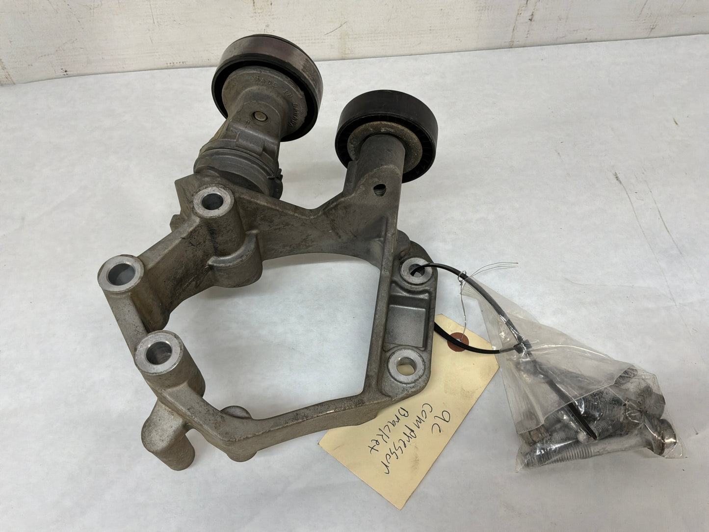 Ac compressor bracket - Day's Parts Yard