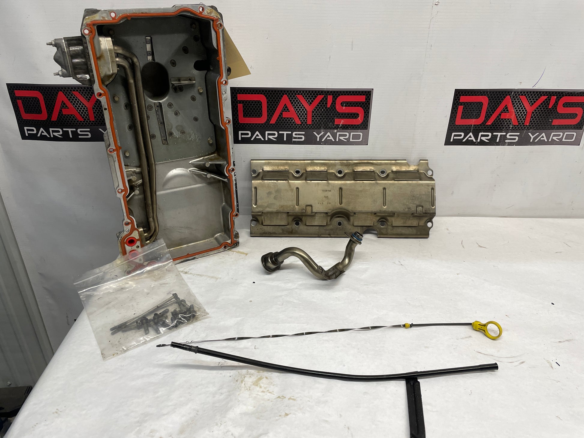 2004 Pontiac GTO Complete Oil Pan Assembly Pick Up Tube Windage Tray Dip Stick OEM - Day's Parts Yard