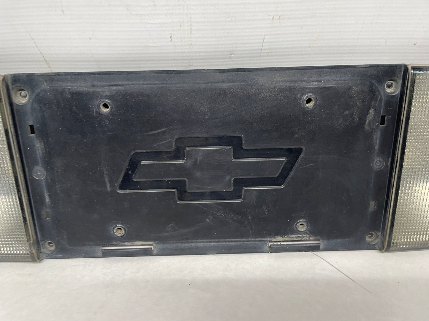 2001 Chevy C5 Corvette Rear License Plate Bracket Finish Panel Reverse Lights OEM - Day's Parts Yard