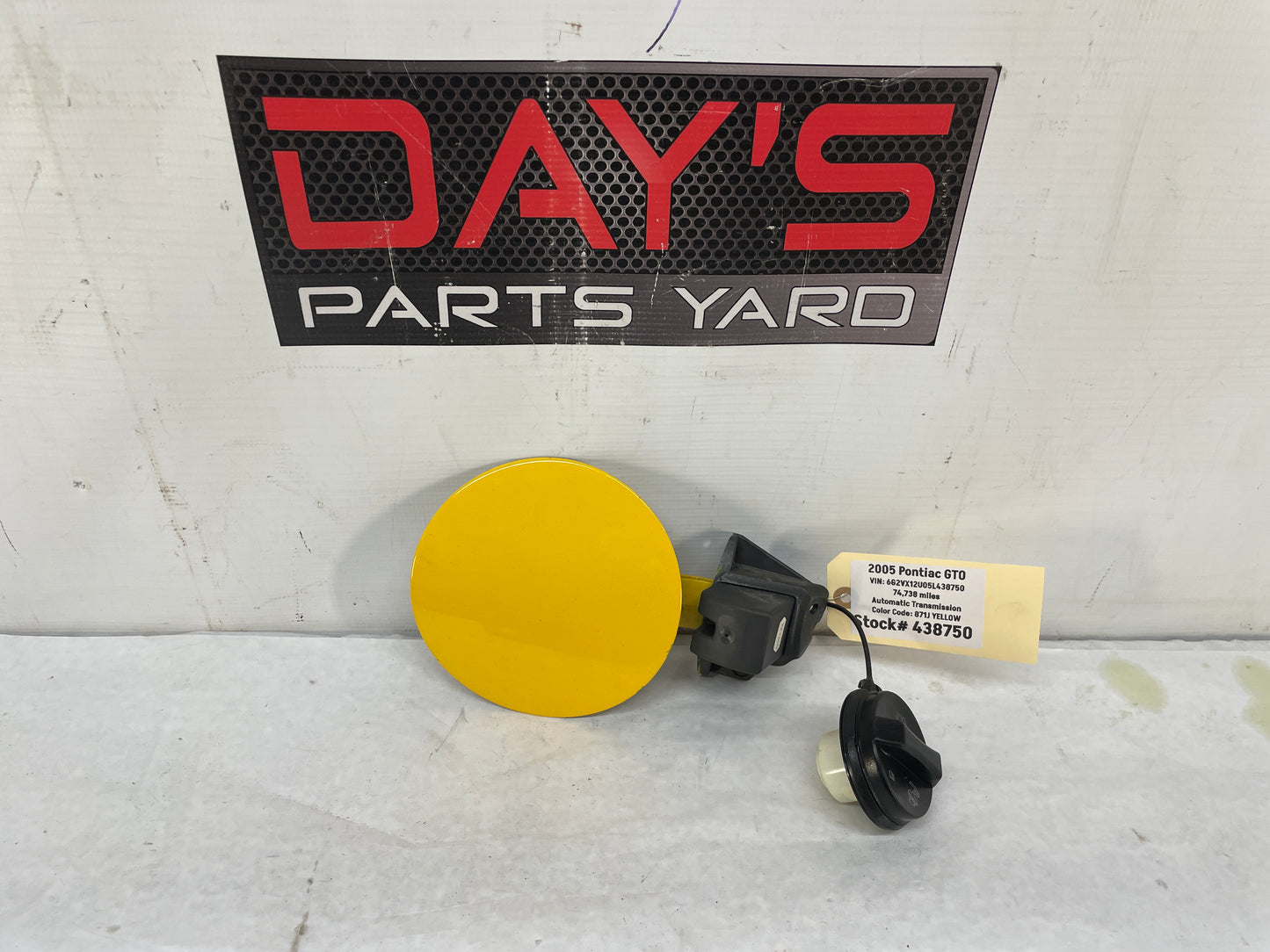 2005 Pontiac GTO Fuel Gas Door Lid Cover Assembly w/ Cap Yellow OEM