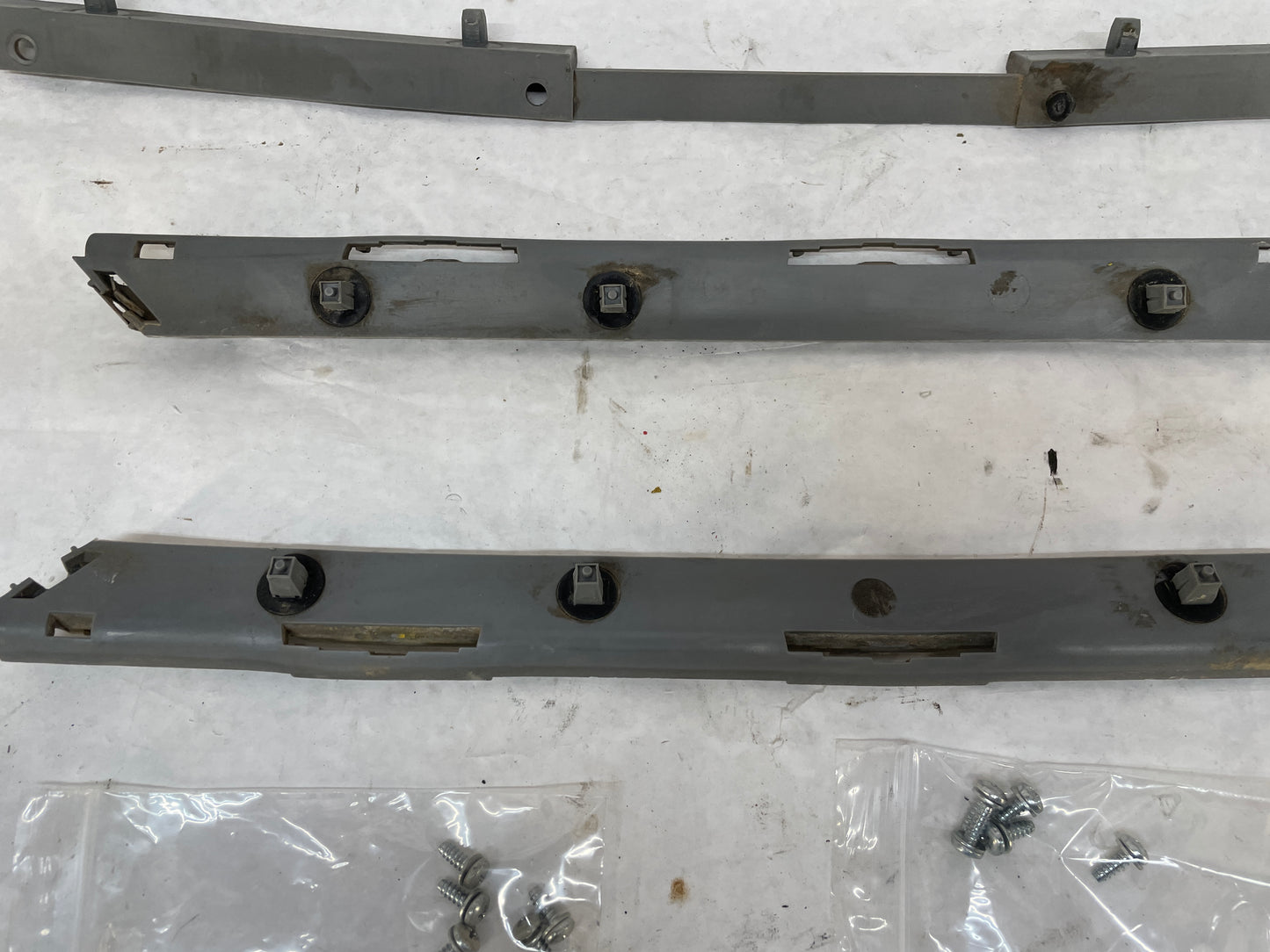 2005 Pontiac GTO RH & LH Rear Bumper Brackets Guides Supports OEM