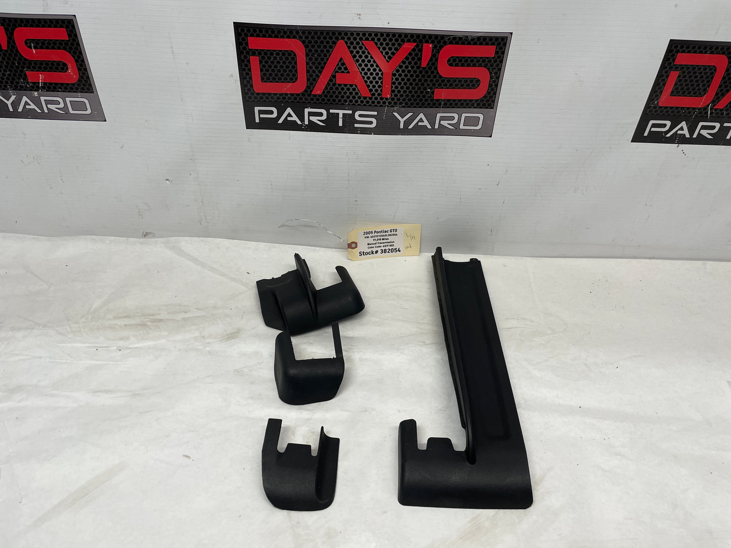 2005 Pontiac GTO LH Driver 4pc Seat Rail Frame Plastic Trim Set OEM - Day's Parts Yard