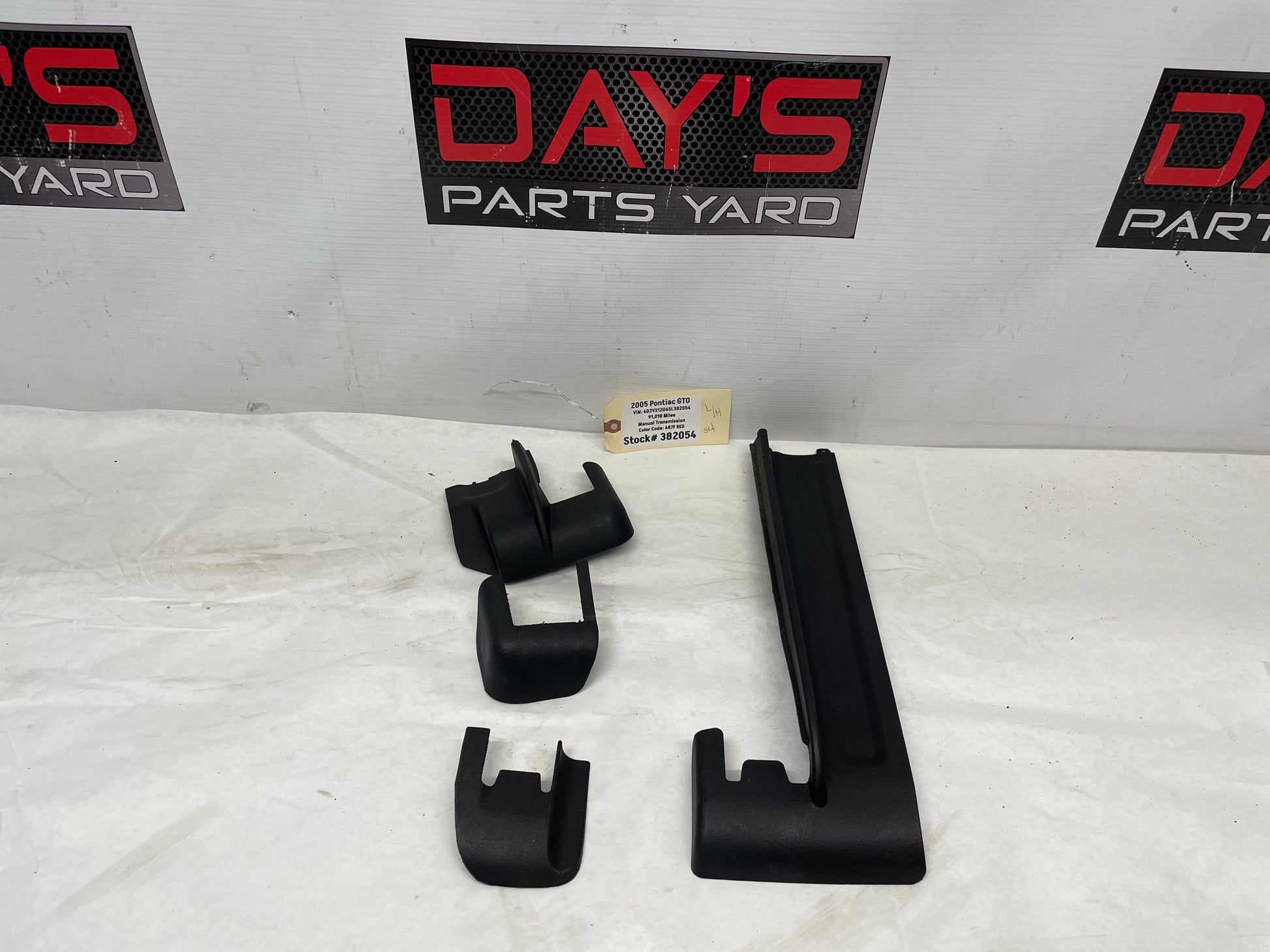 2005 Pontiac GTO LH Driver 4pc Seat Rail Frame Plastic Trim Set OEM - Day's Parts Yard