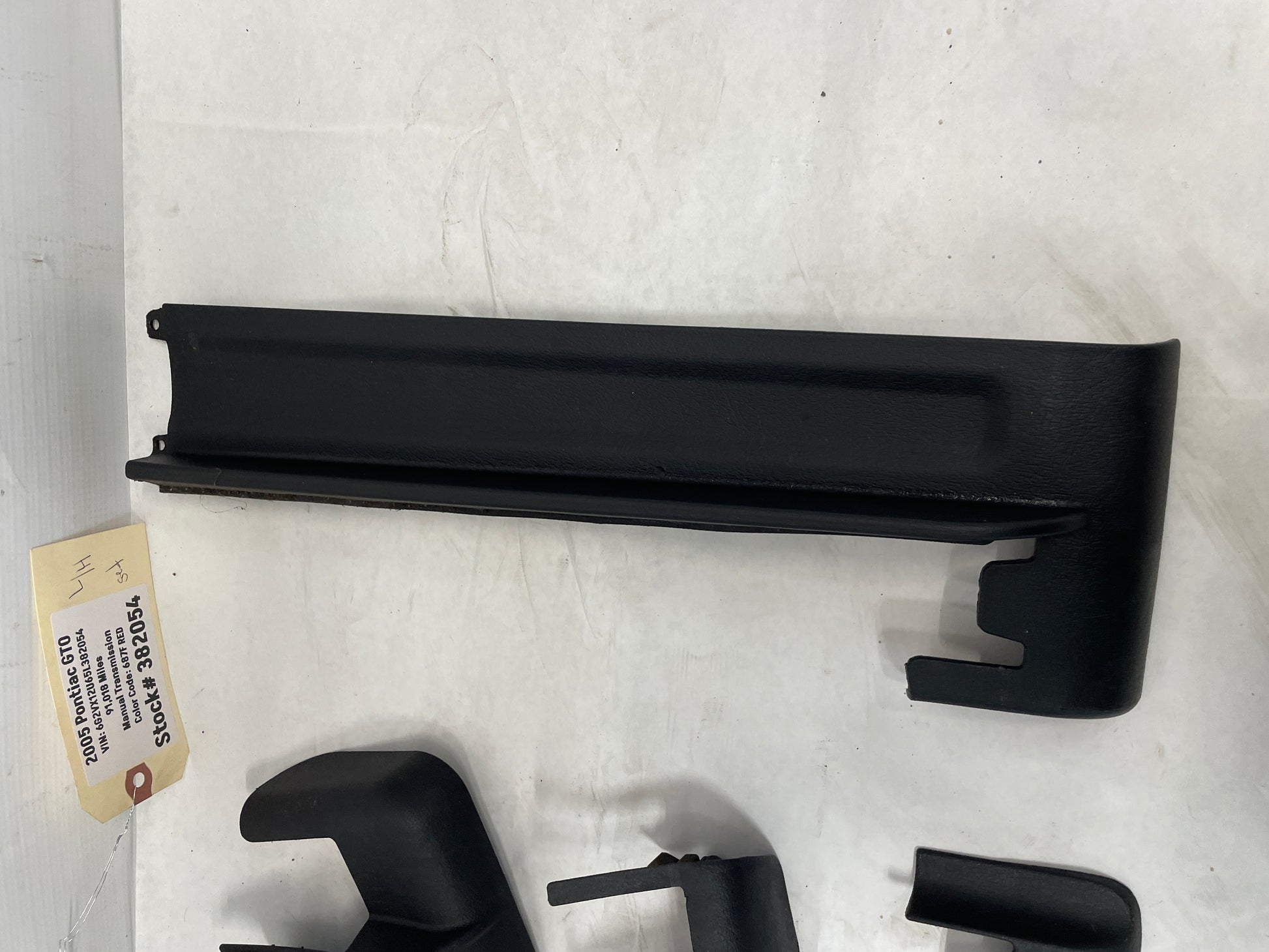 2005 Pontiac GTO LH Driver 4pc Seat Rail Frame Plastic Trim Set OEM - Day's Parts Yard