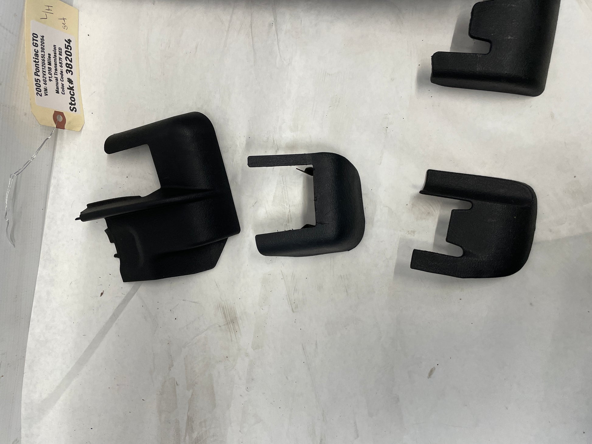 2005 Pontiac GTO LH Driver 4pc Seat Rail Frame Plastic Trim Set OEM - Day's Parts Yard