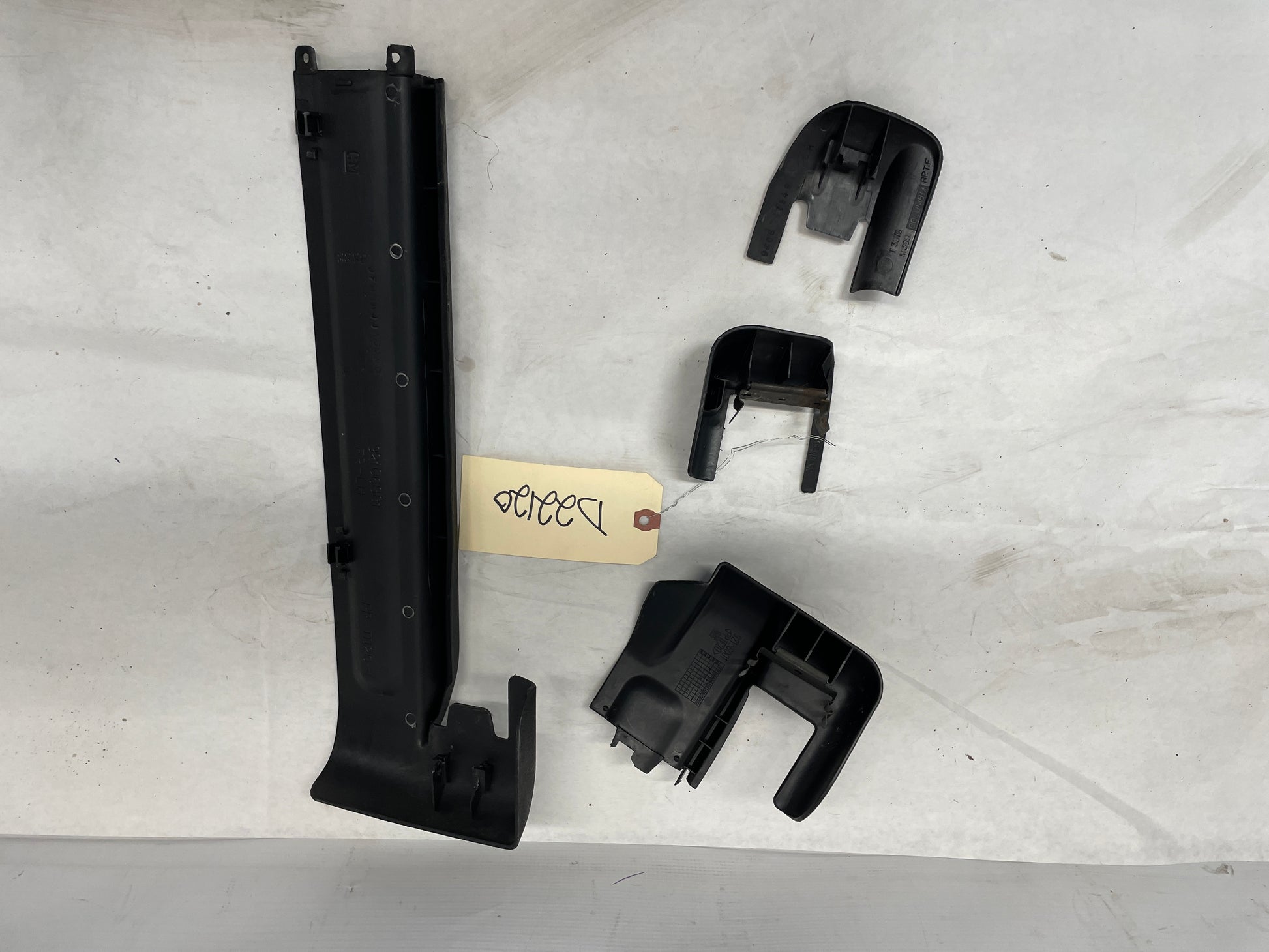 2005 Pontiac GTO LH Driver 4pc Seat Rail Frame Plastic Trim Set OEM - Day's Parts Yard