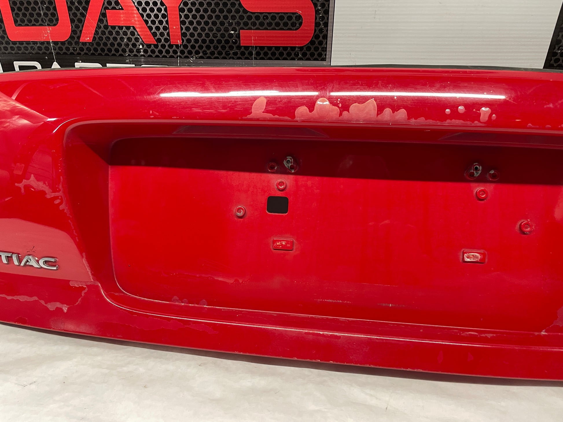 2006 Pontiac GTO Trunk Deck Lid Filler Insert Applique Panel Red OEM - Day's Parts Yard