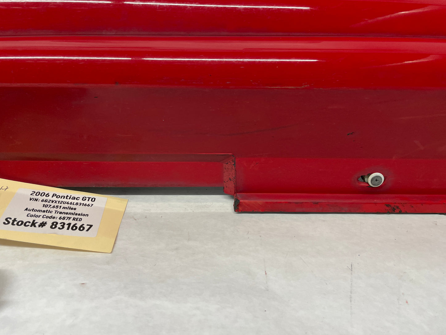 2006 Pontiac GTO LH Driver Rocker Molding Side Skirt Trim Panel Red OEM - Day's Parts Yard