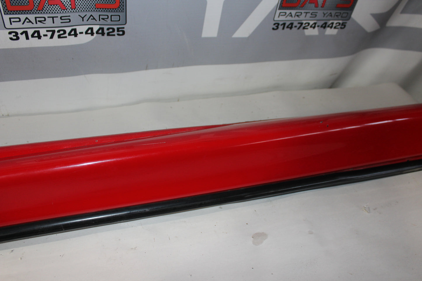 2006 Pontiac GTO LH Driver Rocker Molding Panel Red OEM - Day's Parts Yard