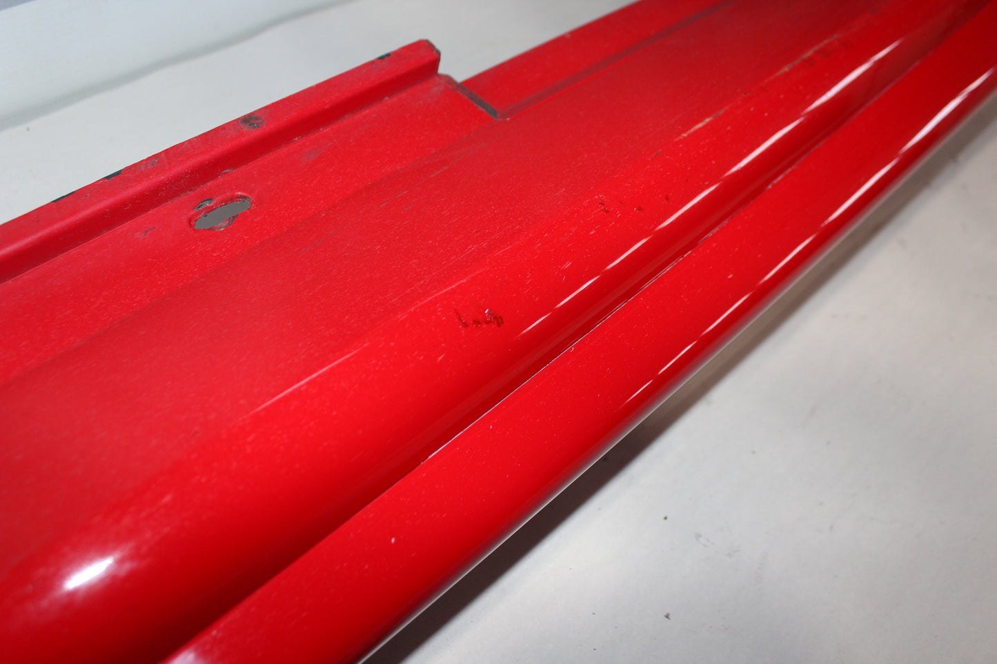 2006 Pontiac GTO LH Driver Rocker Molding Panel Red OEM - Day's Parts Yard