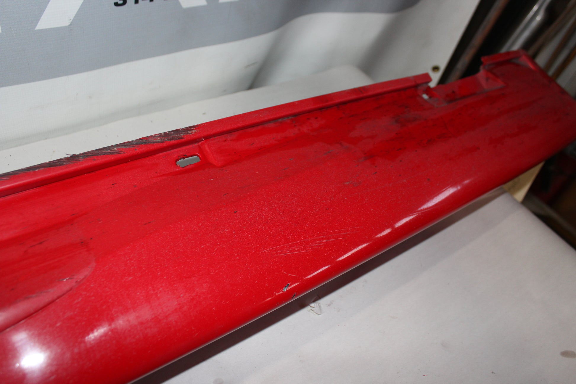 2006 Pontiac GTO LH Driver Rocker Molding Panel Red OEM - Day's Parts Yard
